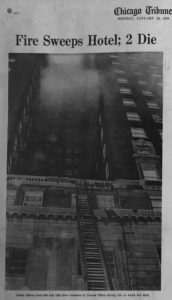 B+W photograph of hotel with smoke coming out of the windows. At bottom is the concrete terrace that Bright jumped to.